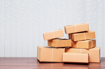 Stack of cardboard boxes on wooden table