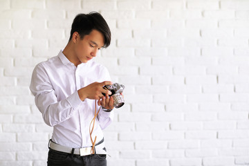 Asian young man with a camera