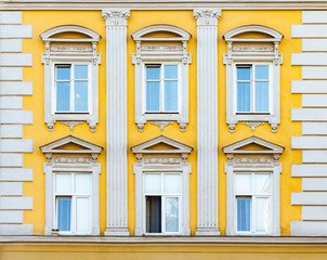 Facade of antique historical building. Windows with decorative stucco elements. Lviv, Ukraine....