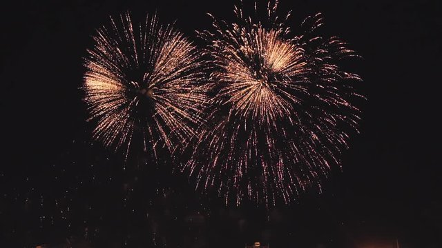holiday fireworks in slow motion on the black sky background. Shot at 100fps.