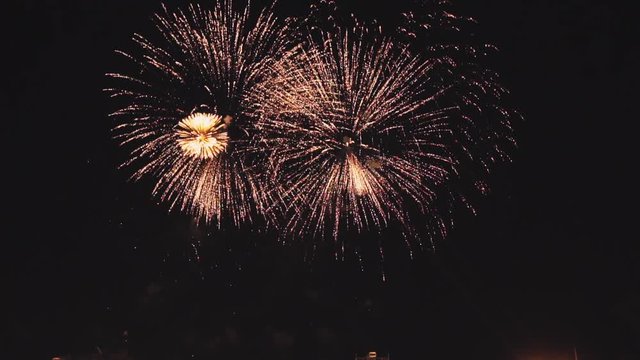 holiday fireworks in slow motion on the black sky background. Shot at 100fps.