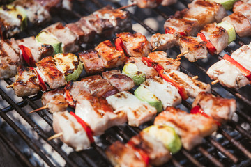 Roasted meat cooked at barbecue. Grill on charcoal and flame.