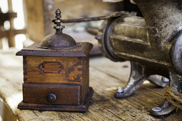 Old coffee grinder made of wood and metal