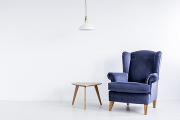 Classic armchair in white room