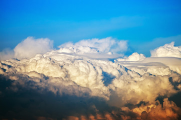 Fototapeta premium Cumulus clouds in the blue sky after a thunderstorm. Beautiful natural landscape