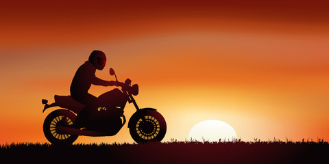 Fototapeta na wymiar moto - motard - liberté - coucher de soleil - seul - solitaire - campagne