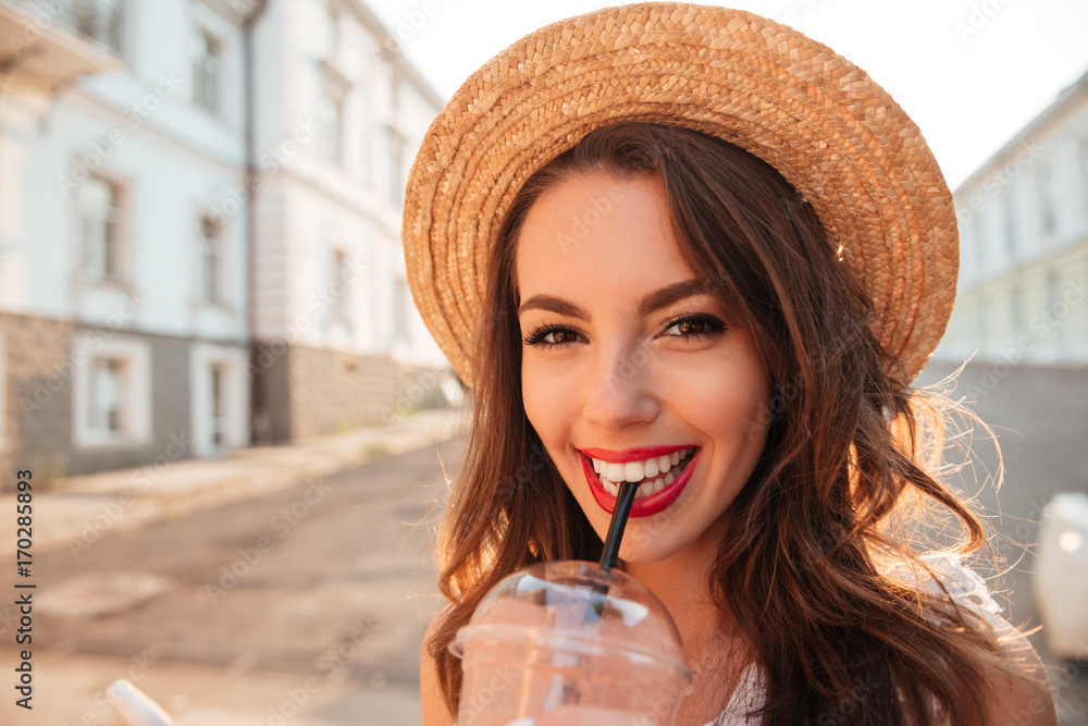 Canvas Prints Happy young woman outdoors drinking juice