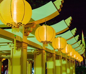 Yellow Chinese Paper Lanterns decoration taken at night street in Thailand