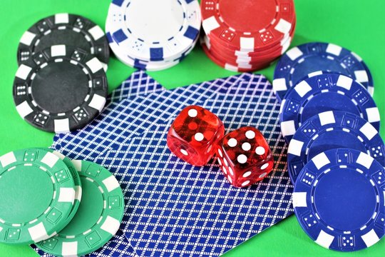 An image of cards, chips and dice - gambling