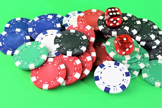 An image of cards, chips and dice - gambling