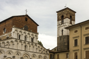 Fototapeta na wymiar Facade of Santa Maria Forisportam church and bell tower in Lucca, Italy