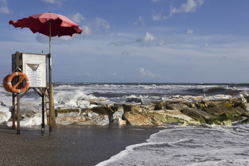 Lifeguard tower in Marina di Massa, Italy, near the cliff in a rough seas day