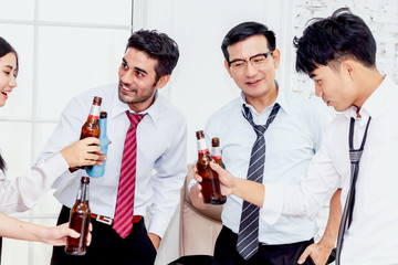 Group of business people professionals successful drink beers in office