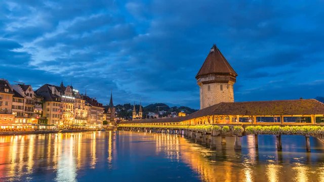 Lucerne city skyline day to night timelapse at Chapel Bridge, Lucerne (Luzern), Switzerland, 4K Time lapse
