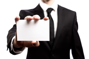 Businessman with a blank business card isolated on a white background