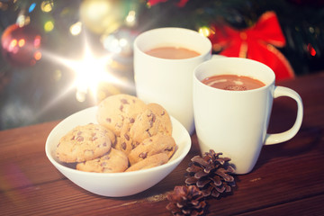 oat cookies and hot chocolate over christmas tree