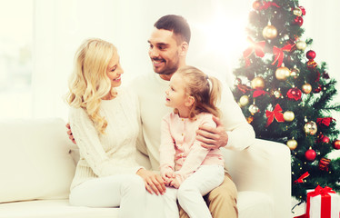 happy family at home with christmas tree