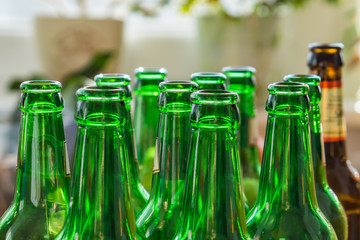 Close up of empty beer bottles. Shallow depth of focus. Concept Save the planet, recycle.|