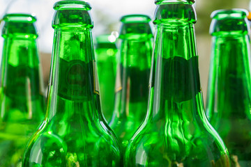 Close up of empty beer bottles. Shallow depth of focus. Concept Save the Planet, Recycle.|