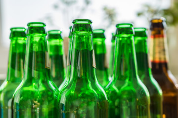 Close up of empty beer bottles. Shallow depth of focus. Concept Save the Planet, Recycle.|