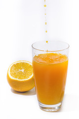 splashing orange juice with oranges against white background By showcake