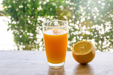 Pouring orange juice into glass.