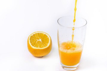 splashing orange juice with oranges against white background By showcake