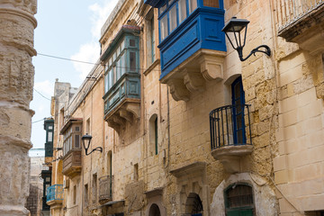 Traditional painted Maltese balconies in Mosta, Malta