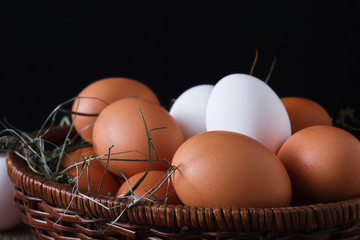 Fresh chicken white and brown eggs on sack closeup, organic farming background