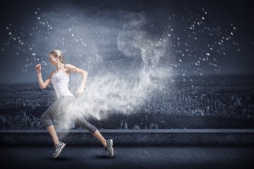 Fototapeta na wymiar Composite image of pretty fit blonde jogging 