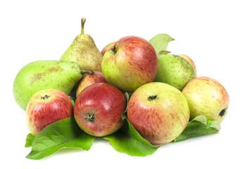 Apples and pears piled in a heap, with green leaves on white background