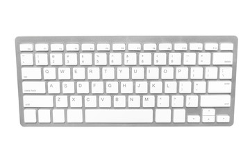 White wireless computer keyboard isolated on white background.