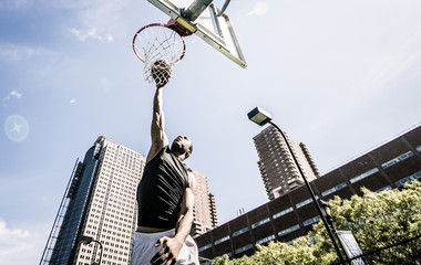 Basketball player making huge slam dunk © oneinchpunch