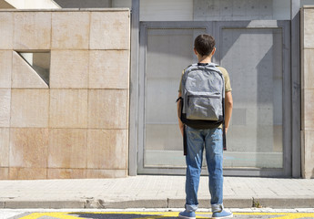 Cheerful child carrying his backpack