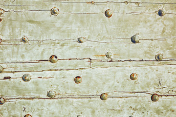texture background iron rivets on wooden surface