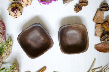 Dark brown burned clay dishes. Ceramics on the white background. Decorative pottery