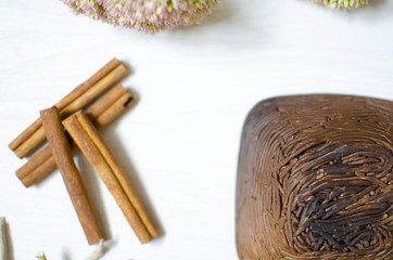 Dark brown burned clay dishes. Ceramics on the white background. Decorative pottery