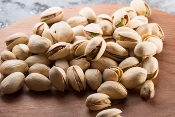 pistachios on a wooden background
