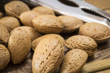 Group of almonds nuts in a wooden table