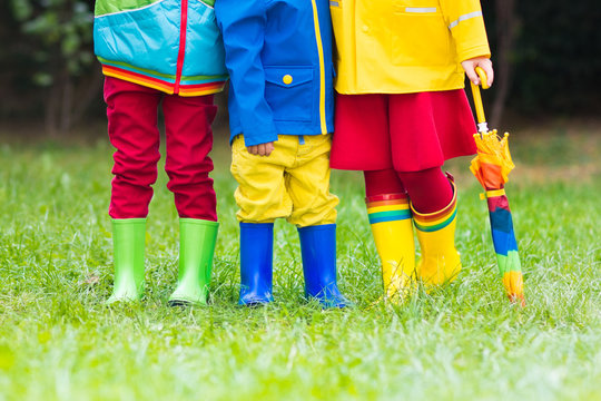 Kids in rain boots. Rubber boots for children.