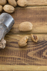 Group of almonds nuts in a wooden table