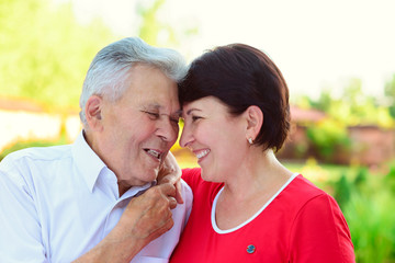 Portrait of happy old father and his 50 years daughter
