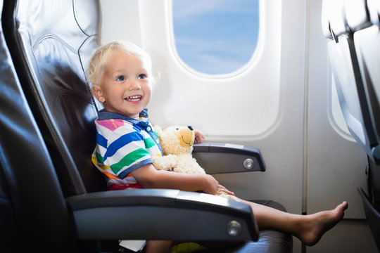 Child flying in airplane.Flight with kids.
