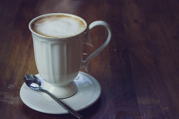 coffee hot drink on wood table , favor drink on wood background