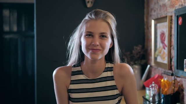 Portrait of a happy female student looking at camera and laughing and smiling, beautiful fashion pretty girl woman