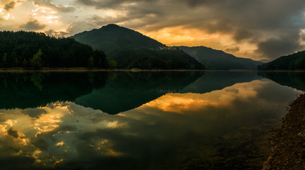 The Eye of Fire: First the Sun bent the Clouds, blew Fire in them and watched us, Lago del Brugneto, Parco dell'Antola, Liguria, Italy, Europe