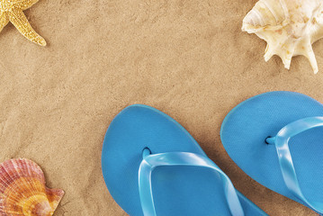 Fototapeta na wymiar Flip flops in the sand at the beach.