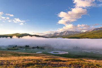 Fototapeta premium mountains fog lake dawn sunlight