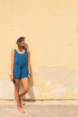 Hipster cute woman posing outdoors with old film camera.