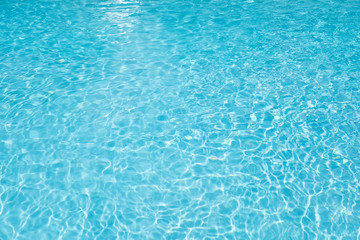 Fototapeta na wymiar Wonderful Blue and bright ripple water and surface in swimming pool, Beautiful motion gentle wave in pool